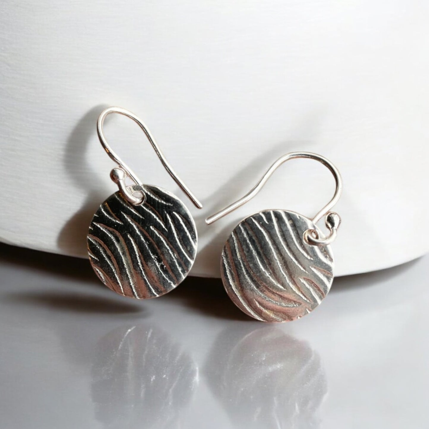Ripple sand textured silver disc earrings