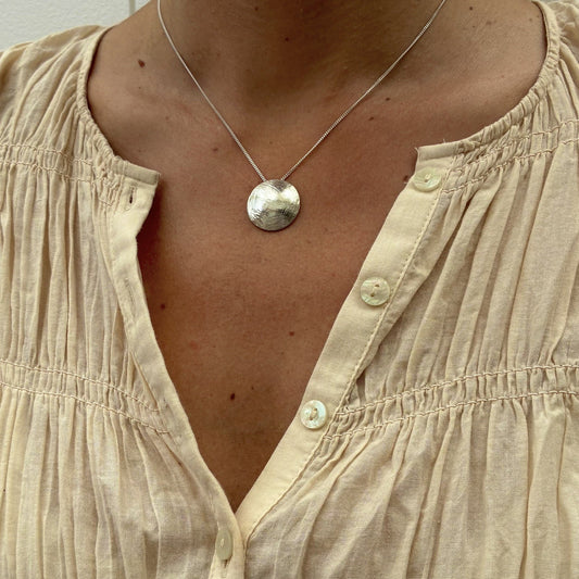 Domed textured silver disc pendant