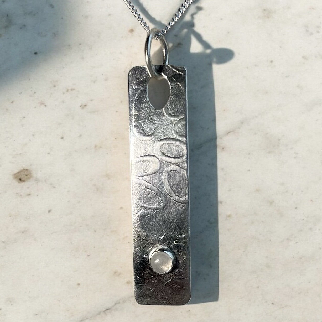 Drop pendant featuring a labradorite gemstone.