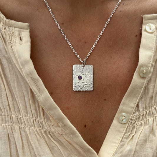 Pendant with birds and amethyst gemstone