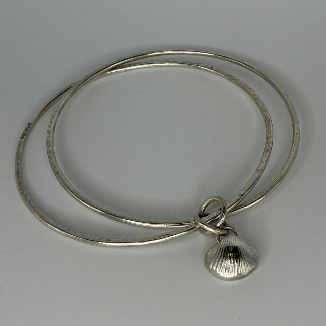 Large double sterling silver bangle with fine silver shell charm