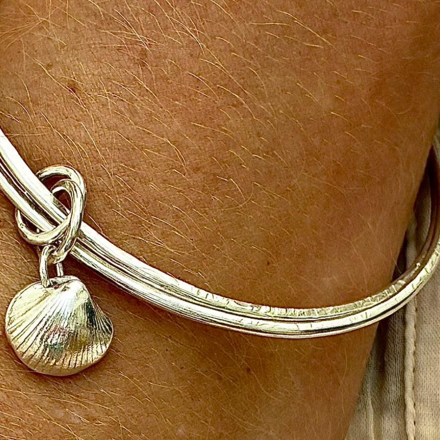Large double sterling silver bangle with fine silver shell charm